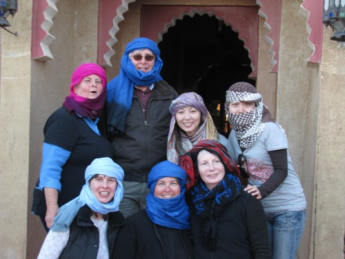 Some of our tour group get into the spirit of riding camels